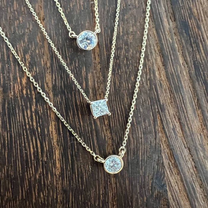 	princess cut diamond necklace yellow gold