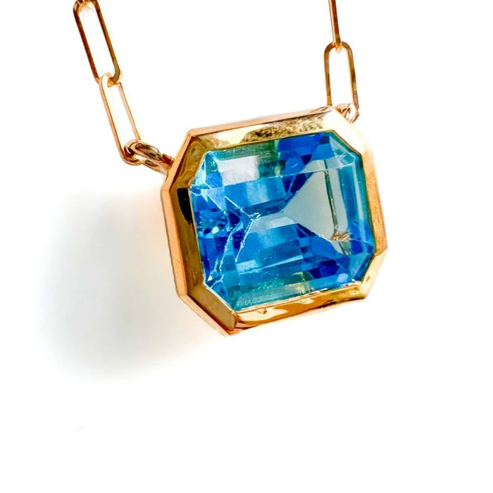 14K Yellow Gold Swiss Blue Topaz Emerald Cut East West Pendant Necklace