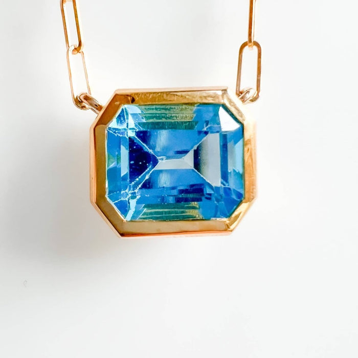 14K Yellow Gold Swiss Blue Topaz Emerald Cut East West Pendant Necklace