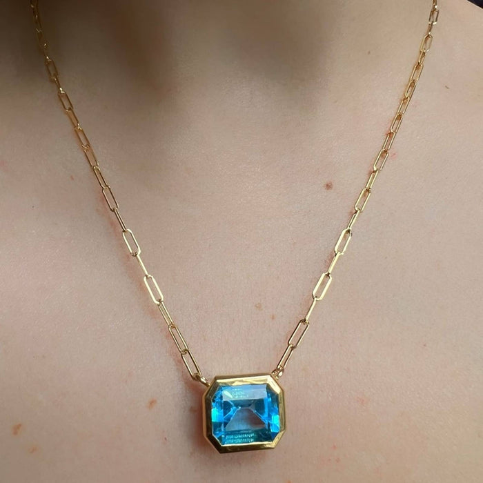 14K Yellow Gold Swiss Blue Topaz Emerald Cut East West Pendant Necklace