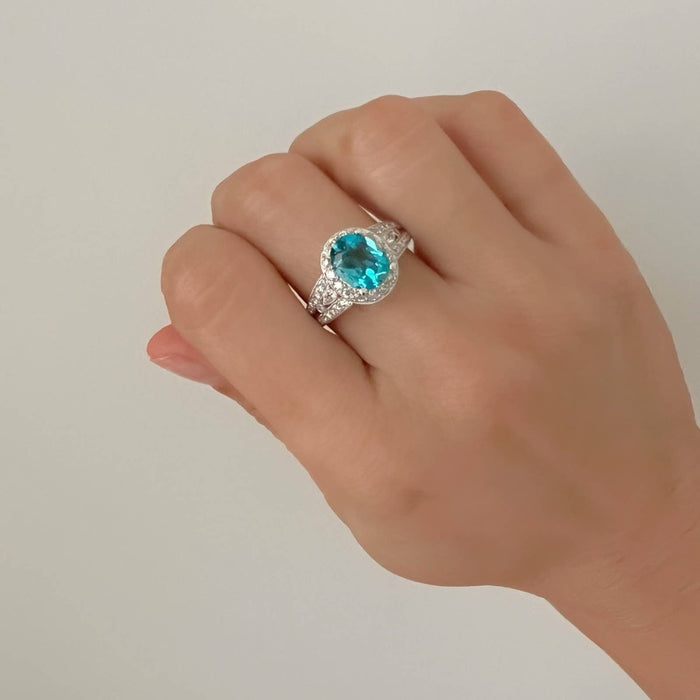 18k White Gold Oval Blue Topaz and Diamond Halo Cocktail Ring